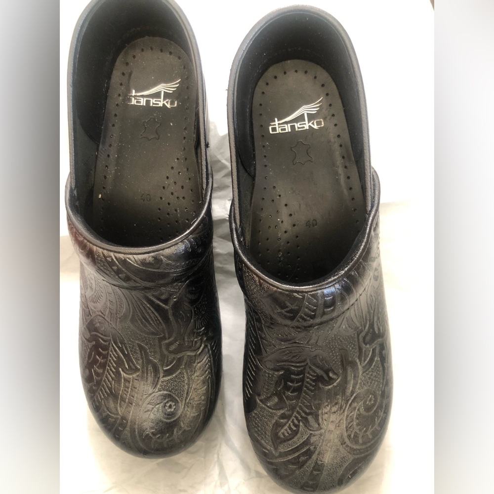 Size 40 black leather Dansko clogs. Lightly used.